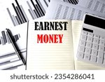 Small photo of EARNEST MONEY text written on notebook on chart and diagram