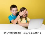 Small photo of Boy and protective boy watching inappropriate content on internet isolated on yellow background. Parental control concept.
