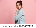 I'm afraid. Fright. Portrait of the scared woman. Business woman standing isolated on trendy pink studio background. Female half-length portrait. Human emotions, facial expression concept. Front view