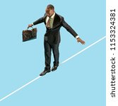 Small photo of Business man on tightrope concentrate to walking isolated on blue background. Business processes, career, risk concepts