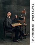 Small photo of Self-portrait. Young man in art action remaking greatest paintings and its artists on old-fashioned background. Retro style, comparison of eras, fashionable characters concept. Artwork, classic.