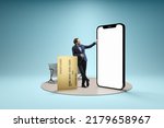 Financial app, online payment. Young man, businessman standing in front of 3d model of cellphone with blank white screen isolated on blue background. Online shopping, choice, ad, sales,