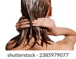 Small photo of Back view of girl with wet hair, applying hair mask against white studio background. Conditioner treatment, nutrition. Concept of beauty, hair care, treatment, natural cosmetics. Copy space for ad