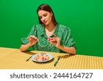 Young woman spinning spaghetti...