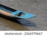 Stranded Wooden Canoe At Low...