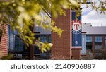 Small photo of Arlington, TX - March 30, 2022: MLB Baseball Texas Rangers' logo banner at Globe Life Field