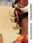 Small photo of Abstract Portrait of a Naga tribesman from rear dressed in traditional warrior attire at Kohima Nagaland India on 4 December 2016