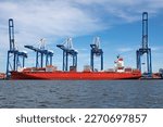 Small photo of CHARLESTON, SC, USA - MARCH 04, 2023, 2023: Spirit of Melbourne, 254-meter container ship, owner Rickmers Ship Mgmt Singapore, Isle of Man-flagged, moored at Wando Welch Terminal, Charleston Harbor.