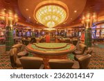 Small photo of Marseille, France: September 10, 2023: View of the casino and gaming tables inside the MSC Orchestra, a cruise ship owned by MSC Cruises.