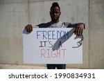 African American Man Holds Up A ...