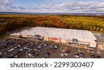 Small photo of Sault Ste Marie, Michigan USA - Oct 16th, 2022: Aerial view of a Meijer supermarket with fall colors