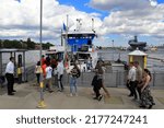 Small photo of Stockholm, Sweden. June 04, 2022. People getting redo to travel by a sightseeing tour boat. Popular tourist spot during the summer in the Swedish capital.