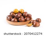 Close-up Chestnuts with peeled  isolated on white background.