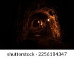 Small photo of Historic gold mining shaft in Walhalla, Melbourne, Australia. This tunnel is what remains of the gold rush era in Australia with the eerie lighting to showcase the dark depths.