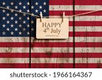 Happy 4th of July Greeting. Congratulations on Independence Day against the background of the old US flag.