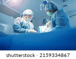 Physicians doing surgery work in operation theater