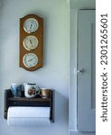 Small photo of Old fashion home clack and paper towel holder copy space backgrounds textures design graphic resources