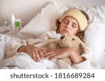 girl with high fever is sleeping