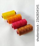 Small photo of strings for sewing. sewing strings. embroidery strings. yellow, orange red brown string