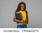 African woman high school student hold portable computer isolated on white background