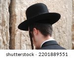 Small photo of Prayer at the Western Wall Close-up, a Hasidic guy praying at the Western Wall Close-up An ultra-Orthodox Jew praying at the Western Wall A Jew praying at a relic to Solomon's Temple