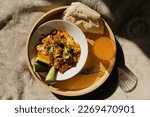 Homemade breakfast
shakshuka with pita bread and orange juice on a wooden tray