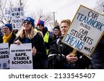 Small photo of Minneapolis, MN, USA - March 8, 2022: Teachers strike for smaller class sizes, more counselors and higher wages.