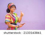 Small photo of image of beautiful african lady with smart phone and a thump up sign- communication concept