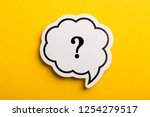 Question mark speech bubble isolated on yellow background.