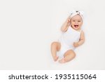 Smiling Newborn Baby On A White ...