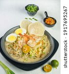 Small photo of Mie Celor, a Palembang South Sumatran style of noodle and egg dish with coconut milk sauce. Served with beansprout, fried shallots, sambal and calamondin. Indonesian culinary