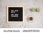 365 new days, 365 new chances. Letter board with motivational quote on grey concrete background with coffee cup. New year resolutions and goal setting, self improvement and development concept. 