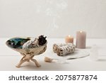 Small photo of Smudge kit with white sage stick, abalone sea shell. Natural elements for cleansing environment from negative energy, adding positive vibes. Spriritual practices, witchcraft concept