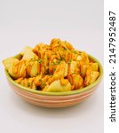 Small photo of Portion of Spanish patatas bravas with spicy sauce