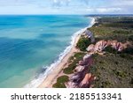 Top view, Aerial view of Pitinga beach in Arraial Da Ajuda, Porto Seguro, Bahia. Landscape of the cliffs with the waters of the Brazilian Northeast Sea.
