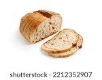 Fresh baked round Bread isolated on white background. Sliced, cutted wheat rye sourdough bread. Tartine country bread. 