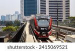 Small photo of Dukuh Atas, Central Jakarta, Indonesia - 2023 September 4th: INKA made Light Rail Transit trainset for Bekasi and Bogor LRT service prepare enter Dukuh Atas LRT Station