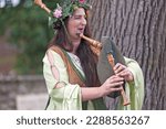 Small photo of Luzarches, France - October 12 2019: A medieval minstrel playing biniou kozh (or biniou-bihan) during the annual 'Medievales' festival.