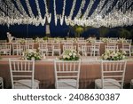 Small photo of Conceptual wedding decoration. Inspirational. Dinner. Family gathering. Special moment a lifetime to remember. Long table. Table setting with arranged chairs