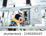 Small photo of Adult electrical engineer inspect the electrical systems at the equipment control cabinet. Installation of modern electrical station