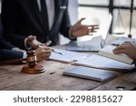 Small photo of justice and law concept. male lawyer working in an office. Legal law, advice, and justice concept. The client is bringing the documents to clarify the law to the lawyer at the prosecutor's office.