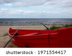 Red Rowboat On The Seashore....