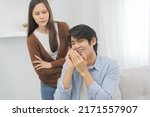 Small photo of Infidelity, suspicion asian young couple love, husband using mobile phone, wife spying his boyfriend while man chat a message, woman sneaky distrust and jealousy, relationship problem.