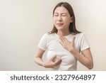 Small photo of Acid reflux disease, suffer asian young woman have symptom gastroesophageal, esophageal, stomach ache and heartburn pain hand on chest from digestion problem after eat food, Healthcare medical concept
