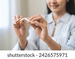 Small photo of Quit, stop smoking, addiction asian young woman, girl refusing cigarette, smoker quitting smoke, hand in broken, break tobacco. Quit bad habit, health care concept. Willpower lifestyle of people.