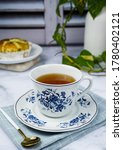 Small photo of A tea time with a snack is happy after hectic day. A close up, bright, shiny and blurry background