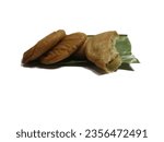 Small photo of Fried tubers on banana leaves, crispy tubers, Indonesian snacks or side dishes, fried tubers, fried sweet potatoes, isolated.
