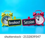 Small photo of Alarm clock and wooden board with text Breakout Session on blue background.