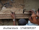 Small photo of Barmer , Rajasthan/India Dec 12 2009 : Wood Carving traditional handicraft in india , artisan from Rajasthan doing differnt work for earning .