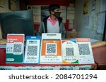 Small photo of Noida, Uttar Pradesh, India-Nov 26 2021: QR code based payment of Different company display at local shop, Digital and contactless scan and Pay QR code of PhonePay, Paytm, Amazon, G pay, Bhim